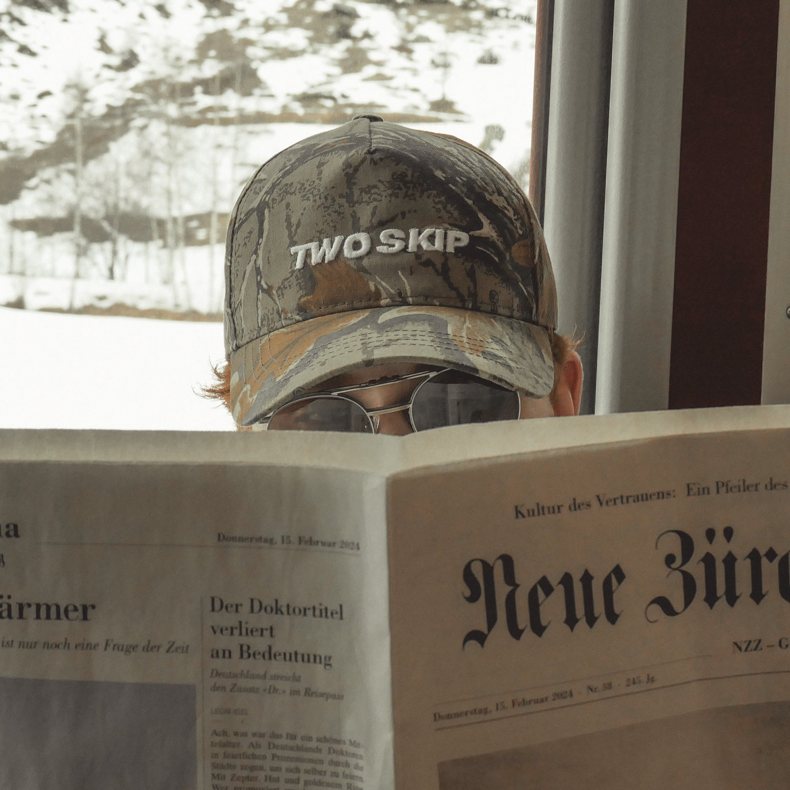 The Camo Wordmark Cap on the Train to Zermatt